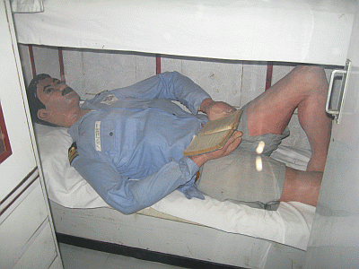 Life-sized model of a sailor taking rest inside the submarine museum